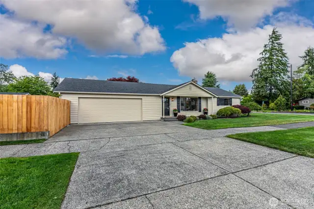 North end rambler has just been refreshed on the exterior and the interior.  Well chosen colors, fresh paint & new fence boards.  Large corner lot provides plenty of parking on quiet street.