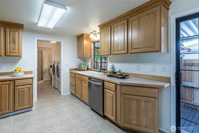 You'll appreciate all the storage & work areas in this kitchen.