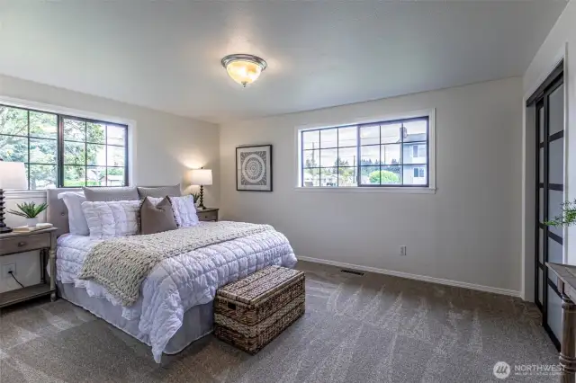 Primary bedroom is large with two closets,