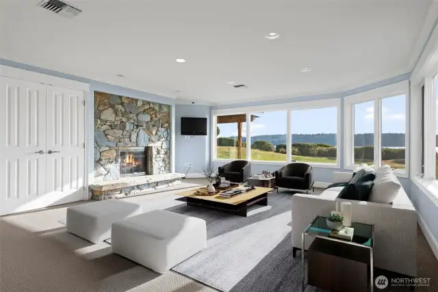 Expansive windows bring in natural light and frame peaceful views, creating a seamless connection to the outdoors and enhancing the room’s spacious, airy feel.