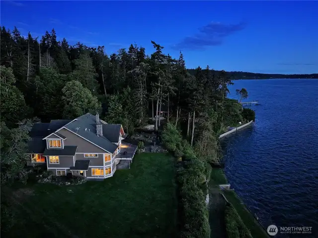 A lasting impression—this final view captures the full beauty and presence of the home, nestled on over 7 acres with unmatched privacy and a timeless connection to the surrounding landscape and waterfront.