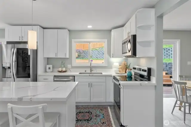 New stainless steel appliances, quartz countertops, huge island. Breakfast nook.