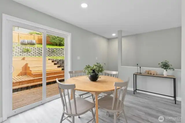 Dining room has a patio door that opens to the deck and backyard.