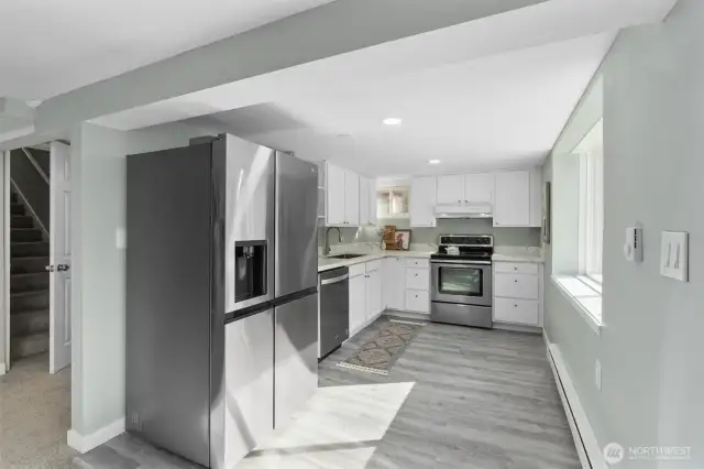 MIL Kitchen has new stainless steel appliances, new cabinets, quartz countertops.