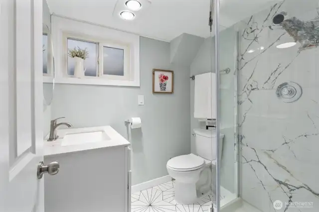 Upgraded bath with quartz countertop, new shower and flooring.