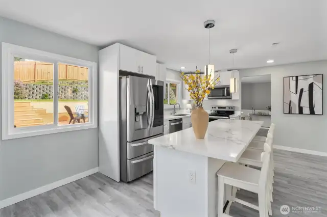 New stainless steel appliances, quartz countertops, huge island. Breakfast nook.