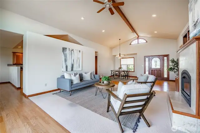 Living room with vaulted ceilings, gas FP, and custom built-ins