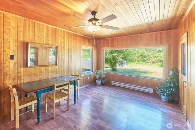 First floor, big window overlooking the back yard, door to deck and steps to back yard.
