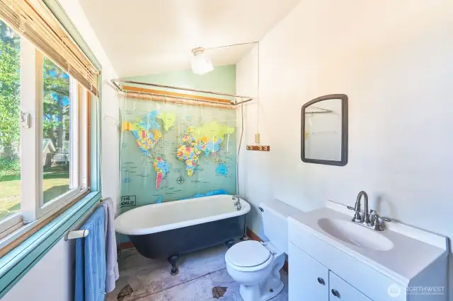 Floor needs a little love but check out that adorable clawfoot tub!