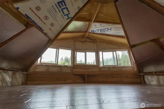 Sleeping loft with dormer to bring in light.