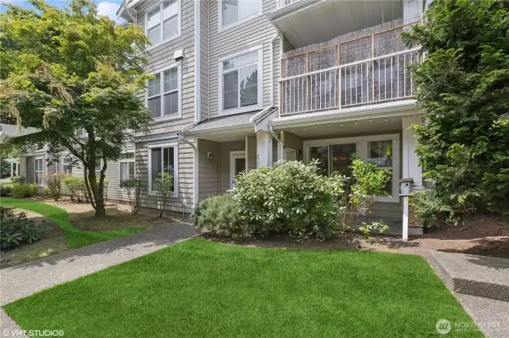 A lush green lawn greets you as you arrive home, offering a vibrant and inviting atmosphere.