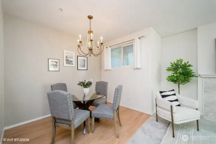 The dining room boasts a stunning chandelier that adds a touch of elegance to the space.