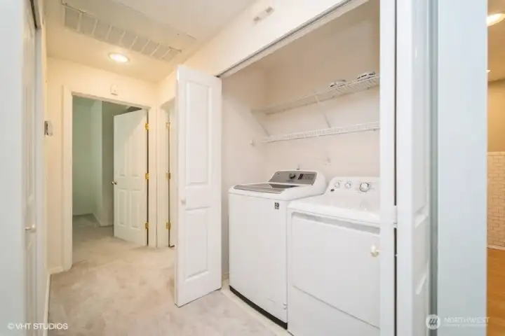 Conveniently located full sized washer and dryer.