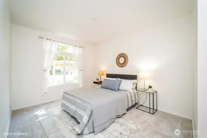 The primary suite boasts an abundance of natural light, creating a bright and airy atmosphere.