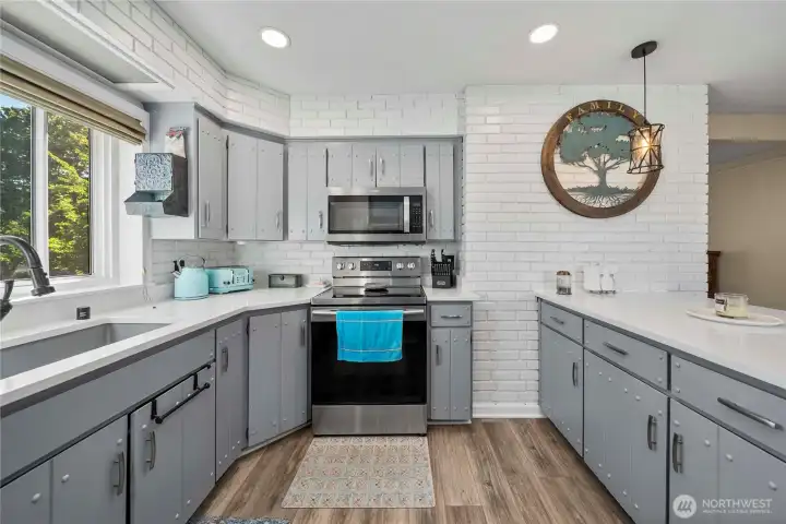 Here's another view of the kitchen showing the beautiful farm sink and ample counter space.