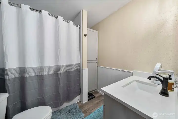 Main floor fully remodeled main bath that serves the two bedrooms on the main floor.