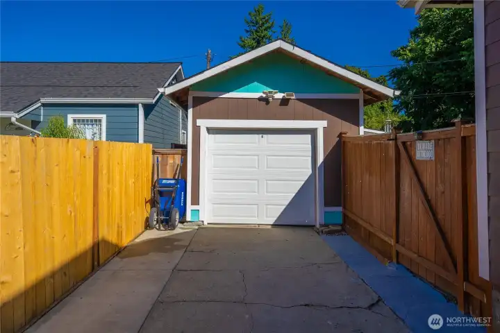 Single garage is behind the drive-thru gate and is also accessible from the backyard.