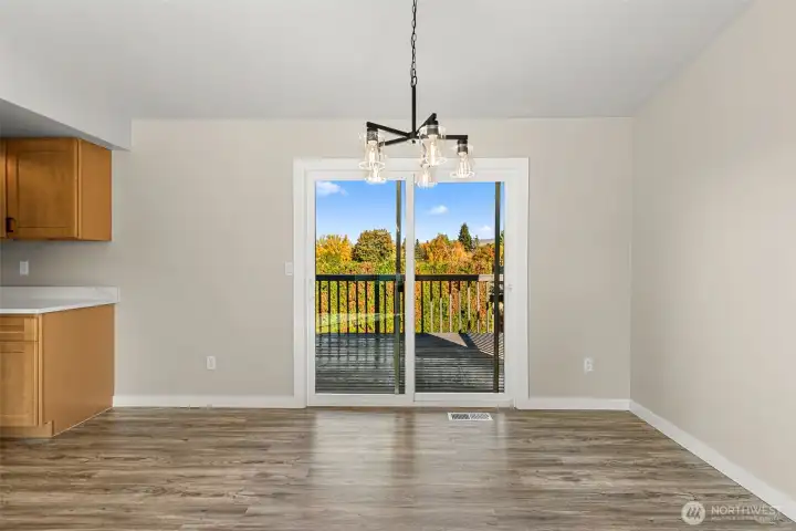 Sliders off dining area to your oversized deck with new paint.