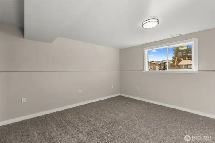 Primary bedroom on lower level but could be used as flex space or 2nd living area.