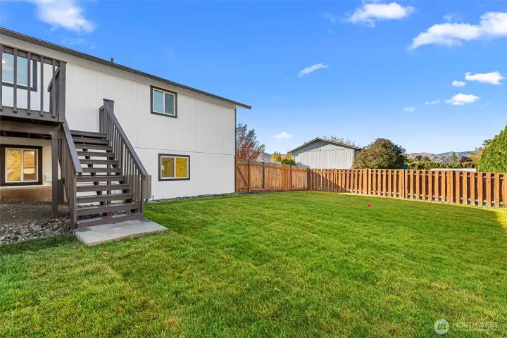 New grass with sprinklers hooked up to irrigation.