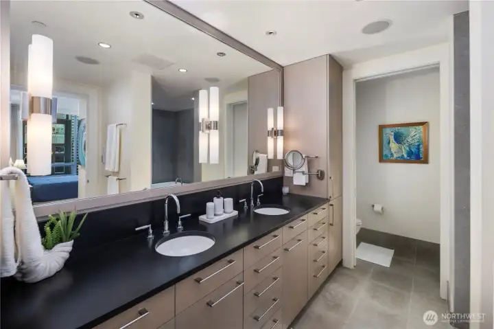 Long double vanity with plenty of room for two and storage. Private Water Closet