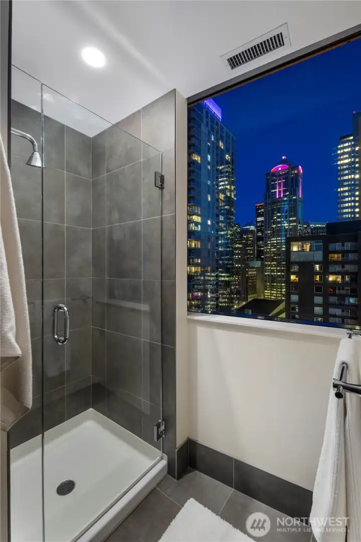 Enjoy stunning city and bay views while washing away the day’s stresses