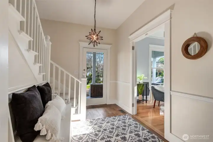 Entry to living room has beautiful leaded glass french doors. They are currently removed, but could easily be put back on.
