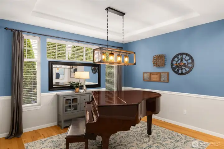 This is the formal dining room (seller used it as a piano studio).