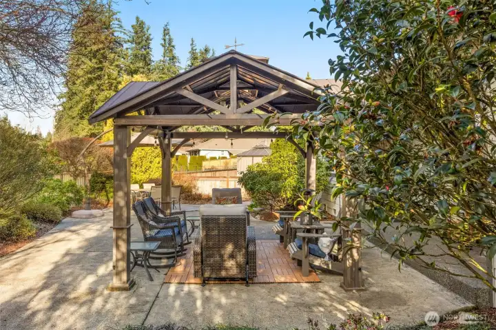 The covered gazebo stays with the home. A perfect place to relax and enjoy your home. This home is also wired for a hot tub and a generator.