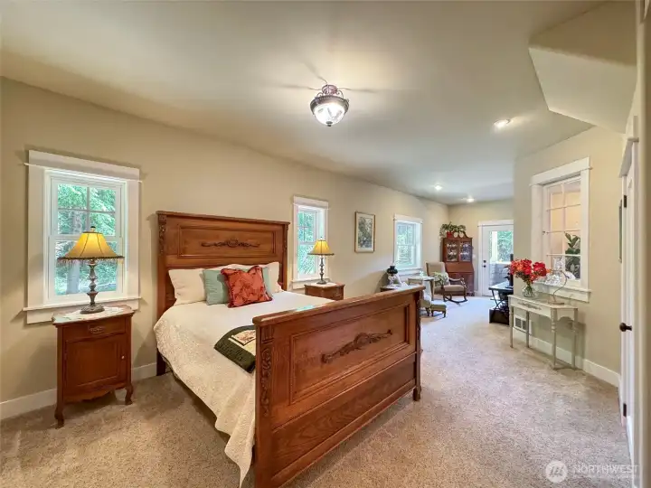 Primary Bedroom situated on the Main Floor with Exquisite Sitting Area