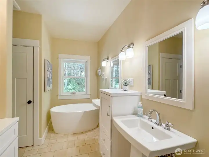 Primary Bath boasts dual sinks, soaking tub, separate shower and water closet
