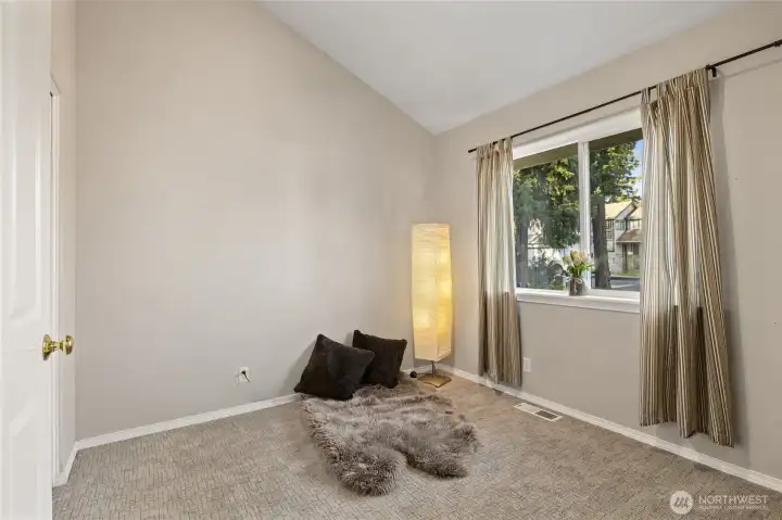 Bedroom located near the living area. Would make a great home office with a view of the front yard! Closet is to the left of the picture.