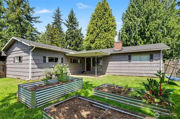 Step outside to a large, fenced backyard with ample space for gardening, entertaining, or outdoor activities.