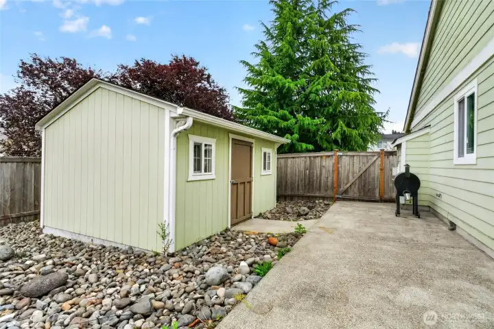 2 outdoor sheds for backyard garden storage.