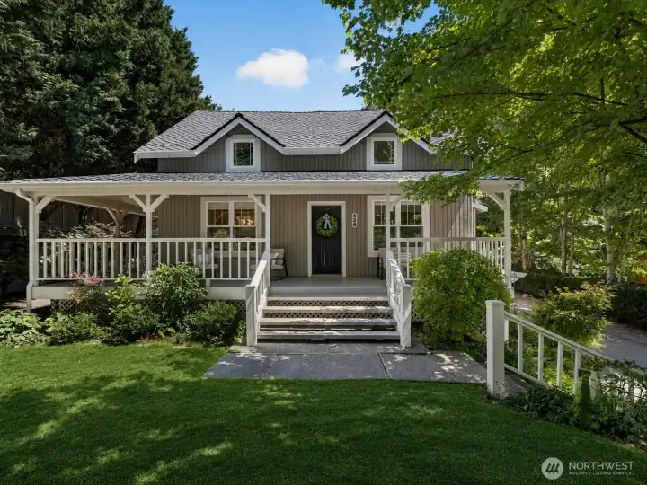 Come home to timeless charm and inviting outdoor living. The expansive wraparound porch sets the stage for slow mornings with coffee, relaxing afternoons in the shade, and peaceful evenings enjoying the beauty of the surrounding landscape.