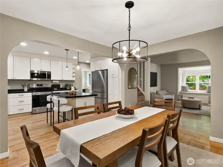 Designed for gathering, this open-concept dining area seamlessly connects the kitchen and living spaces, creating an inviting setting for everything from casual weeknight dinners to memorable holiday celebrations.