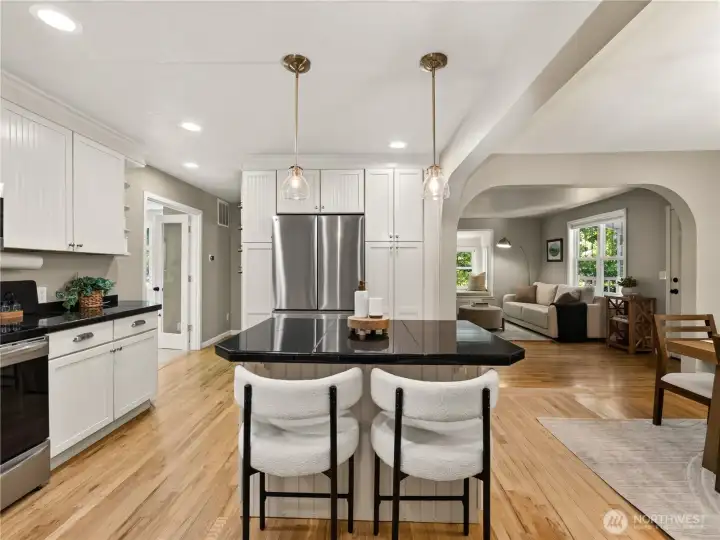 Thoughtful finishes, abundant storage, and an effortless connection to the surrounding living spaces make this kitchen as practical as it is inviting.
