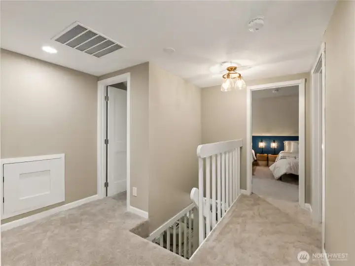 The thoughtfully designed upper level provides a comfortable separation between living and private spaces.