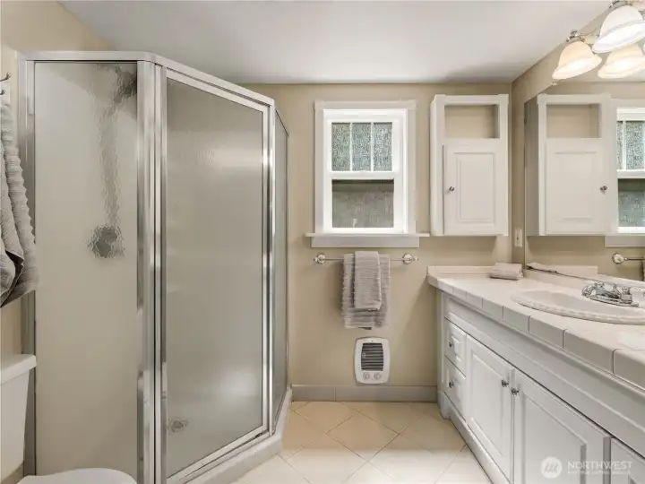 Bright and functional, this well-appointed bathroom is designed for comfort and convenience.