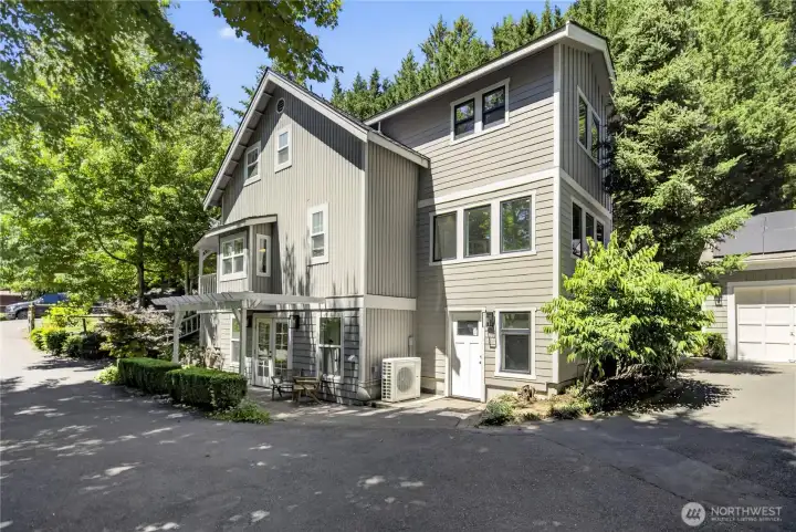 The home's thoughtful expansion blends seamlessly with its original character, creating generous living spaces while preserving its timeless architectural appeal.