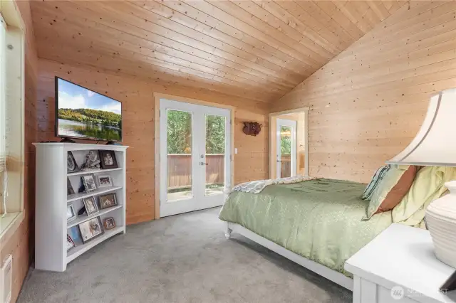 Primary Bedroom w/ French Doors to private Deck