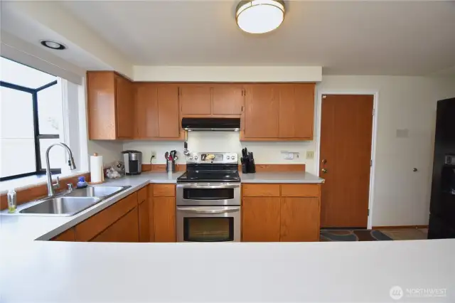 Large kitchen w/plenty of storage and newer appliances. Garage entry into the home provides an easy offload of groceries, etc.