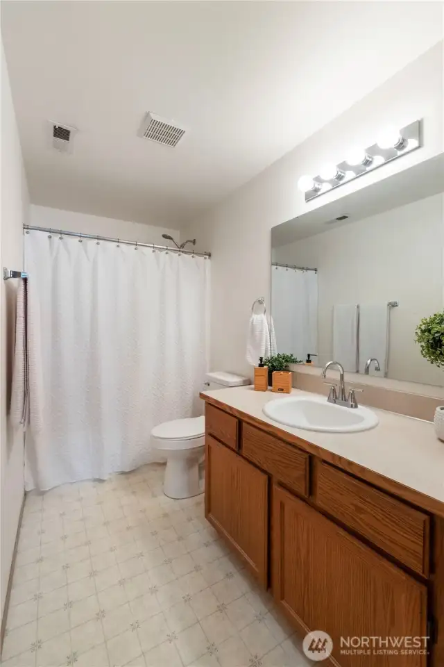 upstairs full hall bath. It has it's own linen closet.