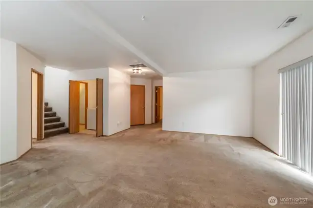Downstairs boasts 2 bedrooms, family room, laundry with storage, half bath and garage access.