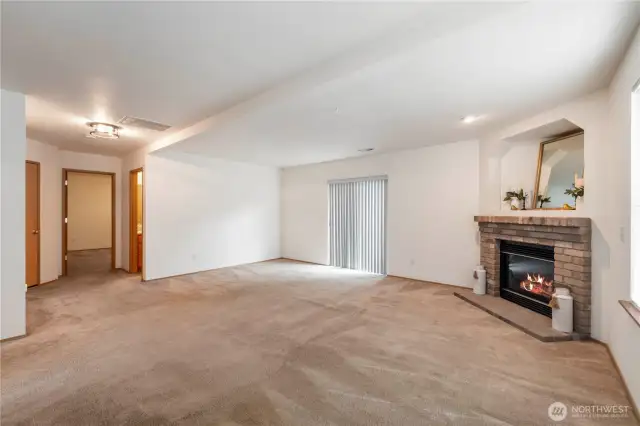 Family room with a sliding glass door opens onto the lower deck.