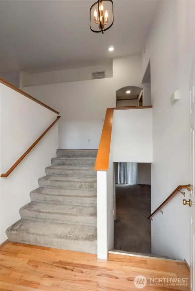 Open and airy front entry with beautiful hardwood floors