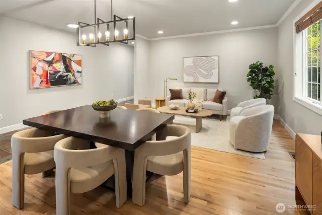 Formal Dining and Living space with hardwood floors throughout.