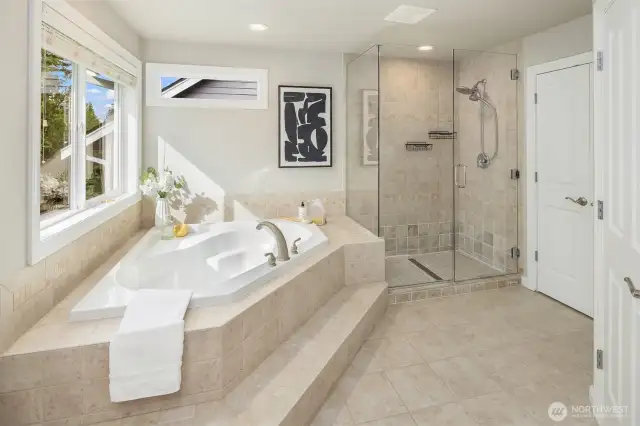 Spa Primary bath with soaking tub and large shower.  Multiple closets offer plenty of storage.