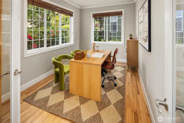 Main level Den off the entry with hardwood floors and large windows.    Drenched in morning sunlight.