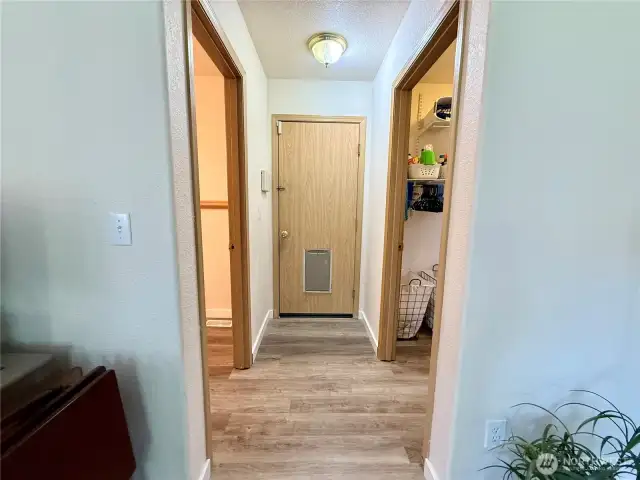 From family room; left door is the half bathroom, forward door is the garage, and right door is the laundry/utility room.